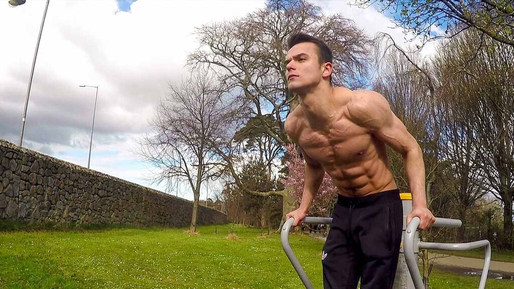 Calisthenics Ireland coach performing a bodyweight dip, demonstrating strength and body composition changes that may not reflect on scale weight