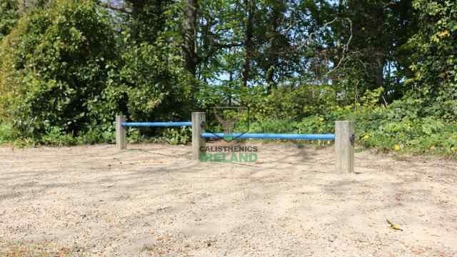 Street workout training equipment at Cabinteely Park in South Dublin, featuring pull-ups bars, push up bar, and dip bars
