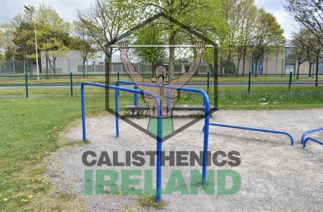 Outdoor gym at Gaels Drumfinn Park in Ballyfermot, featuring pull-up bars, dip bars, and other calisthenics training equipment for strength and fitness