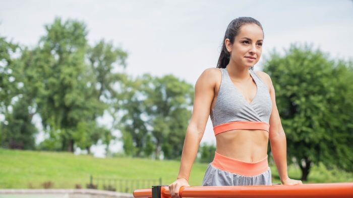 Client receiving bodyweight training feedback through Calisthenics Ireland’s online coaching platform, focused on personalised progress and technique